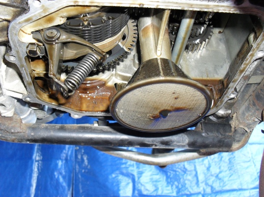 <inside the bottom of a Honda engine>