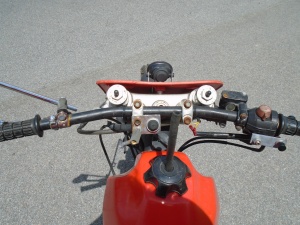 <mountain bike handlebars on motorcycle>