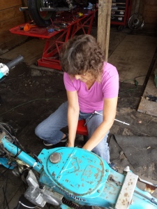 Pretty lady spinning wrenches Honda C70 Passport Restoration